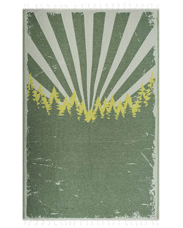  towel with sunburst pattern and tree silhouettes on a green background