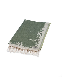 Green towel with white fringe on a white background