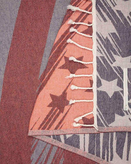 Close-up of a textured fabric with star patterns in various colors.