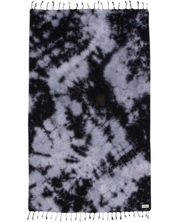 Tie-dye patterned towel with black and white colors on a plain background