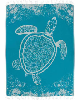 Turquoise towel with a white turtle design on a textured background