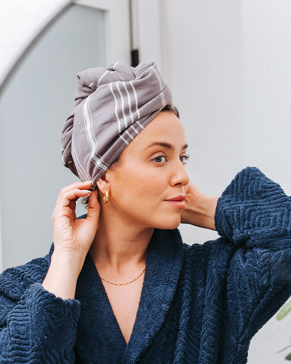 Woman wearing a Sand Cloud hair towel