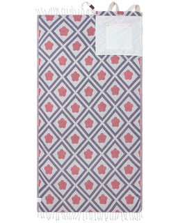 Lime bag towel featuring a diamond flower pattern with a built-in white zip pocket and carrying handles.